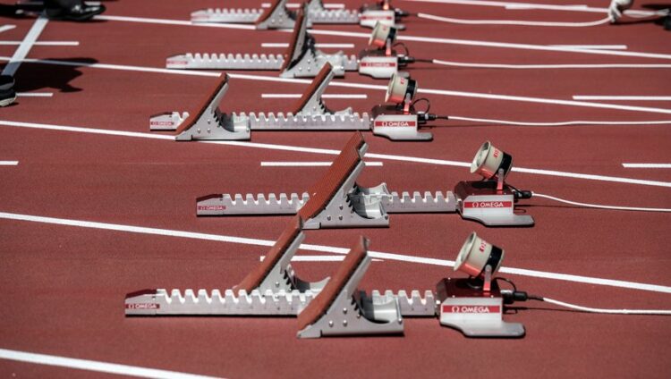 Starting blocks are pictured during a test event for the 2020 Tokyo Olympics, in the National Stadium in Tokyo on May 9, 2021. (Photo by Charly TRIBALLEAU / AFP)