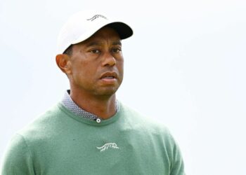 L’agent de sécurité de Tiger Woods explose sur le photographe