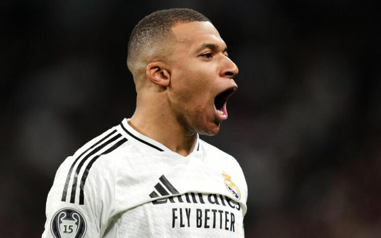 Real Madrid's Kylian Mbappe celebrates scoring their side's second goal of the game during the UEFA Champions League Knockout Phase Play Offs Second Leg match at Santiago Bernabeu, Madrid. Picture date: Wednesday February 19, 2025.